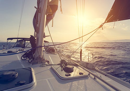 Sepia-toned sailboat in the deep sea